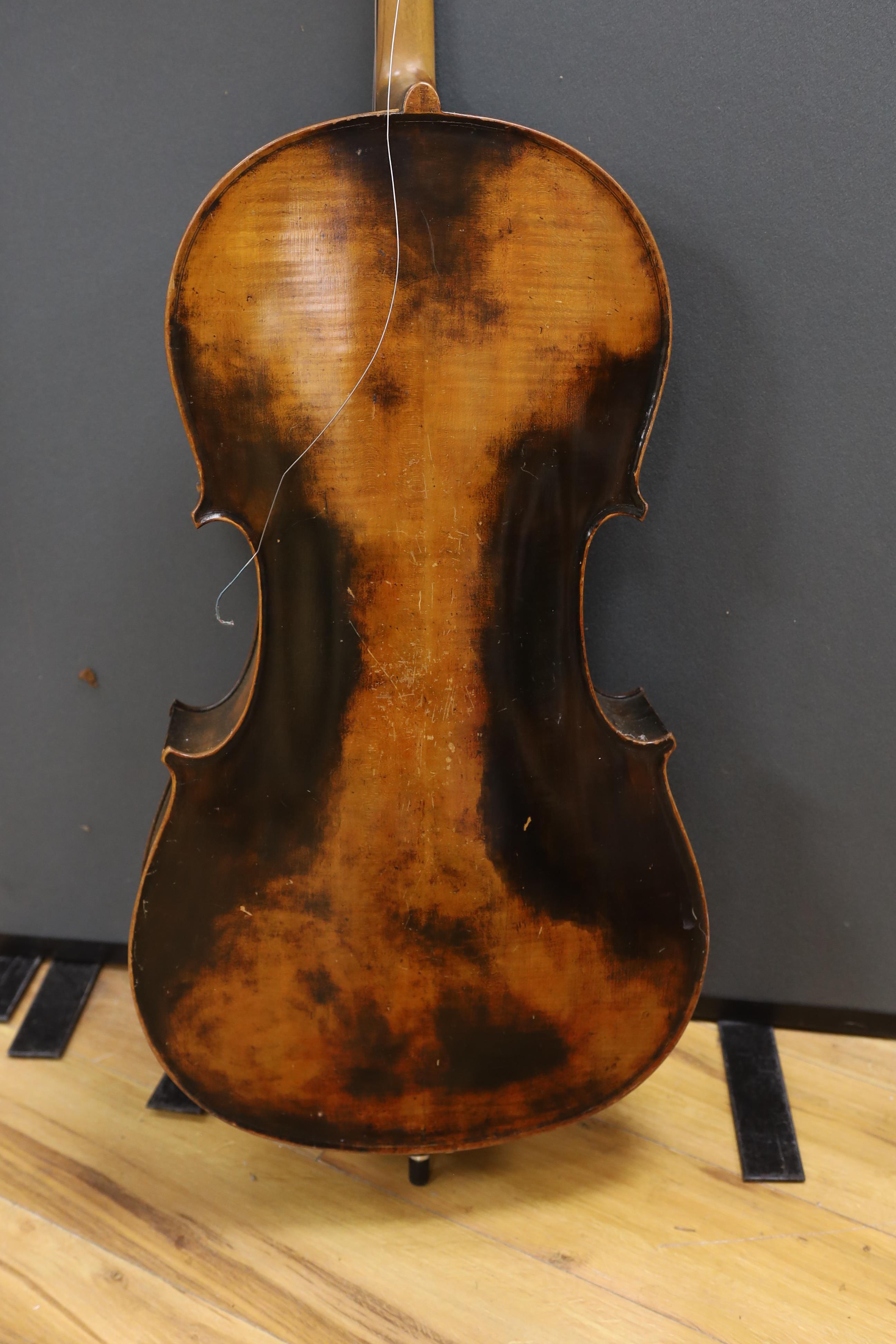 A full size cello labelled Adolf Stowaller, cased, 132cm high